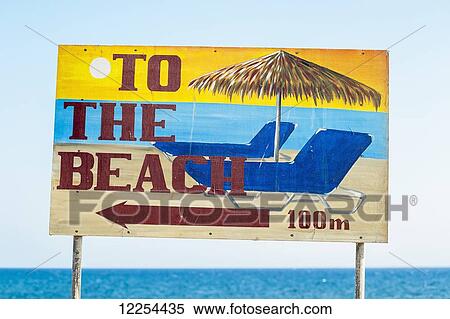 Stock Photography - Sign pointing to the beach; Santorini, Greece. Fotosearch