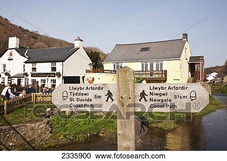 Signpost In Village; Solva, Pembrokeshire Coast Path, Wales, United Kingdom View Large Photo Image Stock Image - Signpost In Village; Solva, Pembrokeshire Coast Path, Wales, United Kingdom. Fotosearch