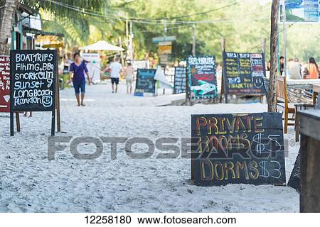 Signs for accommodation and tourist attractions on the white sand of Koh Rong Island; Sihanoukville, Cambodia View Large Photo Image Stock Image - Signs for accommodation and tourist attractions on the white sand of Koh Rong Island; Sihanoukville, Cambodia. Fotosearch