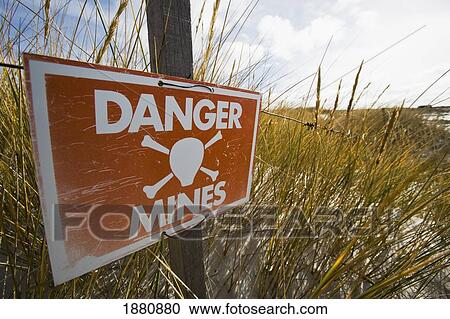 Signs On Beach On East Falkland Warning Of Dangers Of Unexploded Mines And Mine Fields View Large Photo Image Stock Image - Signs On Beach On East Falkland Warning Of Dangers Of Unexploded Mines And Mine Fields. Fotosearch