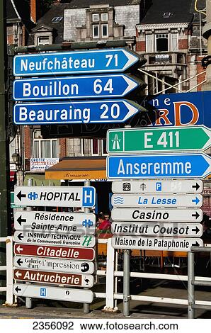 Stock Image - Signs pointing to landmarks; Dinant, Ardennes, Belgium. Fotosearch