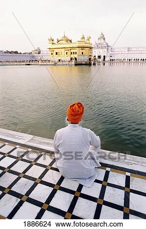 Picture - Sikh Man Sitting Outside Golden Temple. Fotosearch