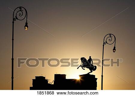 Stock Photo - Silhouette Of A Rooftop Statue Of A Horse And Rider; Havana, Cuba. Fotosearch