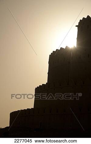 Stock Photography - Silhouette of Al Jahili fort; Al Ain, United Arab Emirates. Fotosearch