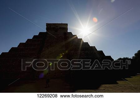 Silhouette of ancient Mayan pyramid with sun burst and blue sky; Chichen-Itza, Yucatan, Mexico View Large Photo Image Stock Photo - Silhouette of ancient Mayan pyramid with sun burst and blue sky; Chichen-Itza, Yucatan, Mexico. Fotosearch