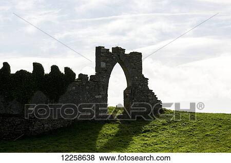Silhouette of arched entrance way in wall; Clifden, County Galway, Ireland View Large Photo Image Stock Photo - Silhouette of arched entrance way in wall; Clifden, County Galway, Ireland. Fotosearch