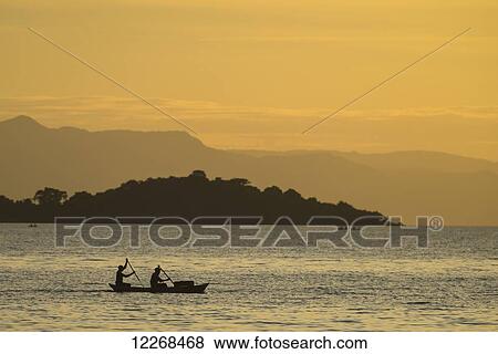 Silhouette of fishermen in dugout canoe leaving Cape Maclear in the evening, Lake Malawi; Malawi View Large Photo Image Stock Photo - Silhouette of fishermen in dugout canoe leaving Cape Maclear in the evening, Lake Malawi; Malawi. Fotosearch