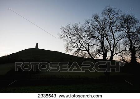 Silhouette Of Hill And Tower; Glastonbury, Somerset, England, Uk View Large Photo Image Stock Image - Silhouette Of Hill And Tower; Glastonbury, Somerset, England, Uk. Fotosearch