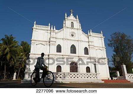 Silhouette of man on bicycle in front of old Portuguese church; Goa, India View Large Photo Image Stock Photograph - Silhouette of man on bicycle in front of old Portuguese church; Goa, India. Fotosearch