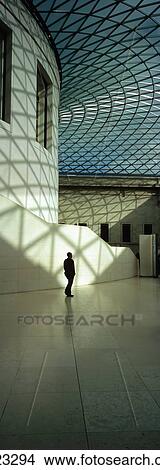 Picture - Silhouette Of Man Passing Reading Room In Great Court Of British Museum, London, England. Fotosearch