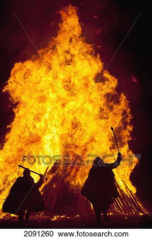 Silhouette Of Men Dressed As Norman Soldiers In Front Of Large Bonfire On Beach, Hastings Bonfire Night, East Sussex, Uk View Large Photo Image Stock Image - Silhouette Of Men Dressed As Norman Soldiers In Front Of Large Bonfire On Beach, Hastings Bonfire Night, East Sussex, Uk. Fotosearch