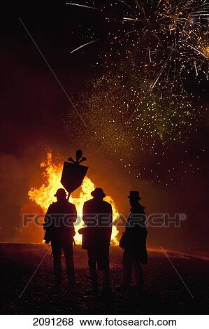 Silhouette Of Men In Front Of Large Bonfire On Beach, Hastings Bonfire Night, East Sussex, Uk View Large Photo Image Stock Photo - Silhouette Of Men In Front Of Large Bonfire On Beach, Hastings Bonfire Night, East Sussex, Uk. Fotosearch