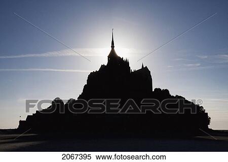 Silhouette Of Mont-Saint-Michel And Mudflats In The Bay, As Seen From The East, France View Large Photo Image Stock Photography - Silhouette Of Mont-Saint-Michel And Mudflats In The Bay, As Seen From The East, France. Fotosearch