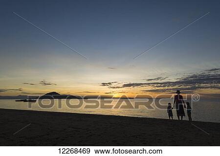Silhouette of mother with boy and girl on beach at Cape Maclear at sunset, Lake Malawi; Malawi View Large Photo Image Stock Photo - Silhouette of mother with boy and girl on beach at Cape Maclear at sunset, Lake Malawi; Malawi. Fotosearch