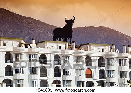 Silhouette Of The Black Osborne Bull Sitting On A Hill Behind Los Boliches; Fuengirola Malaga Province Costa Del Sol Spain View Large Photo Image Stock Photography - Silhouette Of The Black Osborne Bull Sitting On A Hill Behind Los Boliches; Fuengirola Malaga Province Costa Del Sol Spain. Fotosearch