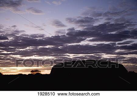 Stock Image - Silhouette Of Uluru At Dusk, Kata Tjuta National Park, Northern Territory, Australia. Fotosearch