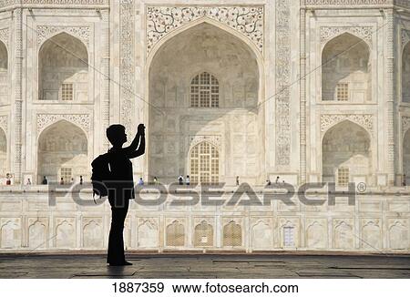 Silhouette Of Woman With Rucksack Photographing The Taj Mahal View Large Photo Image Stock Photo - Silhouette Of Woman With Rucksack Photographing The Taj Mahal. Fotosearch