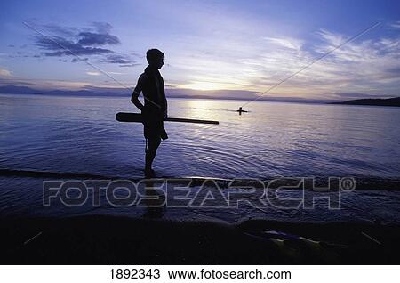 Silhouetted Boy Standing On Edge Of Lake View Large Photo Image Stock Image - Silhouetted Boy Standing On Edge Of Lake. Fotosearch