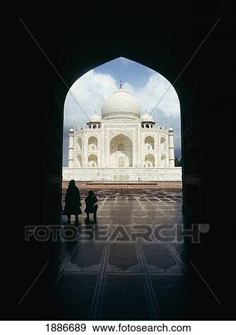 Stock Photo - Silhouetted Tourists In Archway Of The Taj Mahal. Fotosearch