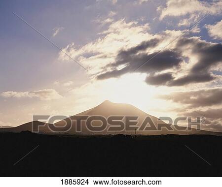 Silhouetted Volcano At Sunset, Lanzarote View Large Photo Image Picture - Silhouetted Volcano At Sunset, Lanzarote. Fotosearch