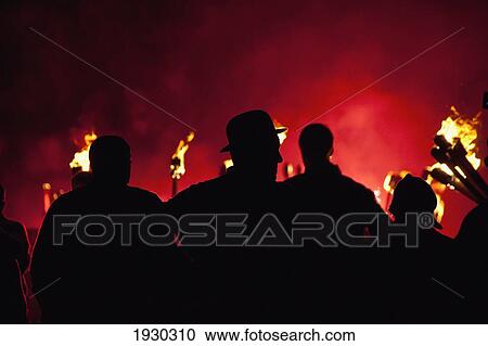 Silhouettes of men with lit torches on Guy Fawkes Day; Newick, East Sussex, England View Large Photo Image Stock Image - Silhouettes of men with lit torches on Guy Fawkes Day; Newick, East Sussex, England. Fotosearch