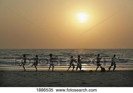 Silhouettes Of People Doing Tai Chi By The Sea On The Beach At Sunset View Large Photo Image Stock Photography - Silhouettes Of People Doing Tai Chi By The Sea On The Beach At Sunset. Fotosearch