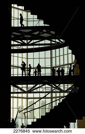 Stock Photography - Silhouettes of people in the Museum of Islamic Art; Doha, Qatar. Fotosearch