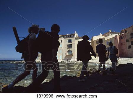 Silhouettes Of People Walking Along Beside Small Beach; St Tropez, France View Large Photo Image Stock Photograph - Silhouettes Of People Walking Along Beside Small Beach; St Tropez, France. Fotosearch