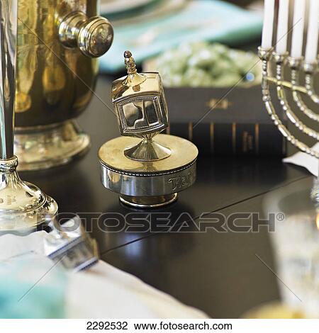 Silver dreidel on dining table; Victoria vancouver island british columbia canada View Large Photo Image Stock Image - Silver dreidel on dining table; Victoria vancouver island british columbia canada. Fotosearch