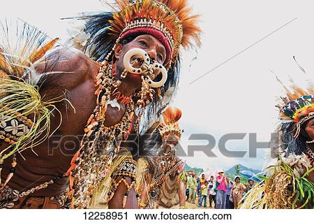 Stock Image - Sing-Sing performer at Milne Bay Canoe Festival; Tufi, Milne Bay Province, Papua New Guinea. Fotosearch