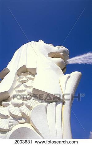 Stock Image - Singapore, Famous Lion Fountain Close-Up Detail View From Underside, Blue Skies. Fotosearch