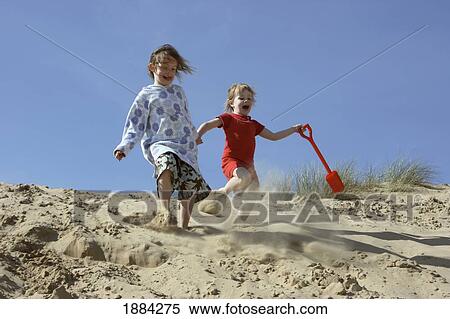 Sisters Running Down Sand Dunes Holding Hands View Large Photo Image Stock Photography - Sisters Running Down Sand Dunes Holding Hands. Fotosearch