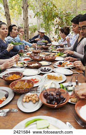 Sitting down for a meal; Cappadocia, Turkey View Large Photo Image Picture - Sitting down for a meal; Cappadocia, Turkey. Fotosearch