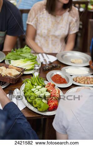 Sitting down for a meal; Cappadocia, Turkey View Large Photo Image Stock Image - Sitting down for a meal; Cappadocia, Turkey. Fotosearch