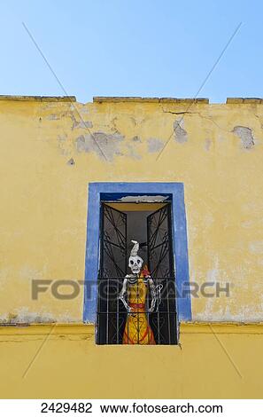 Skeleton statue peering out of a window; Guanajuato, Mexico View Large Photo Image Stock Image - Skeleton statue peering out of a window; Guanajuato, Mexico. Fotosearch