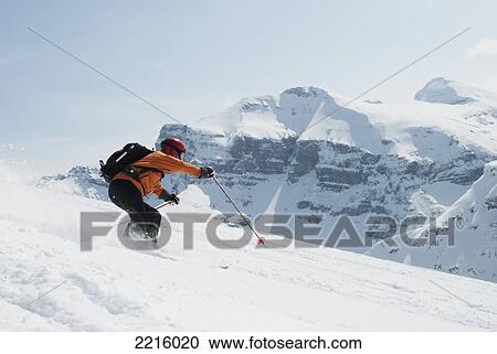 Stock Image - Skier At On Bye Bye Bowl At Sunshine Village Ski Resort In The Canadian Rockies, Banff, Alberta, Canada. Fotosearch