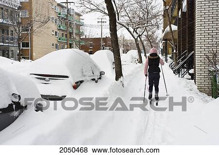 Skier On A Sidewalk After A Snowstorm, Montreal, Quebec View Large Photo Image Stock Photo - Skier On A Sidewalk After A Snowstorm, Montreal, Quebec. Fotosearch