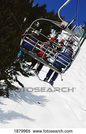 Skiers Going Up Chairlift, Alberta, Canada View Large Photo Image Stock Photography - Skiers Going Up Chairlift, Alberta, Canada. Fotosearch