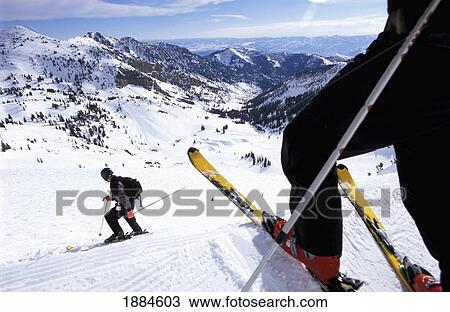 Stock Image - Skiiers On Ski Slope, Low Angle. Fotosearch