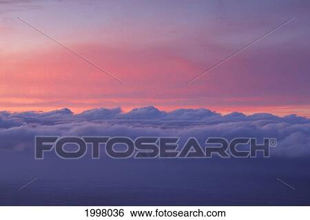 Stock Photograph - Sky At Sunset With Layer Of Puffy Clouds Beautiful Purple And Pink Colors. Fotosearch