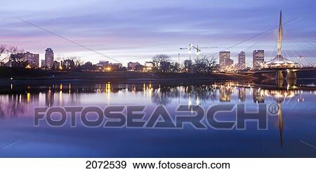 Stock Photo - Skyline And Esplanade Riel Bridge, Red River In Foreground, Winnipeg, Manitoba. Fotosearch