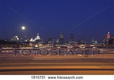 Stock Image - Skyline At Dusk With Moon With Waterloo Bridge. Fotosearch