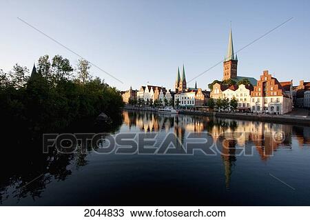 Skyline Reflected In The Holstenhafen, Lubeck, Germany View Large Photo Image Stock Image - Skyline Reflected In The Holstenhafen, Lubeck, Germany. Fotosearch