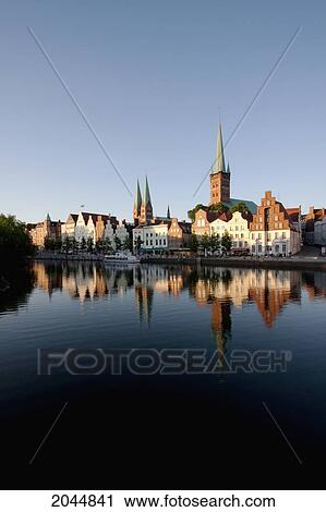 Stock Image - Skyline Reflected In The Holstenhafen, Lubeck, Germany. Fotosearch