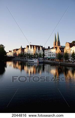 Stock Photograph - Skyline Reflected In The Holstenhafen, Lubeck, Germany. Fotosearch