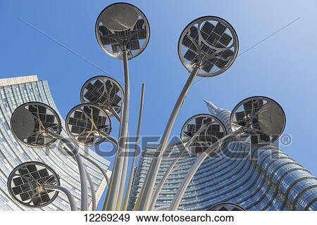 Stock Photo - Skyscrapers and street lamp in financial district; Milan, Lombardy, Italy. Fotosearch