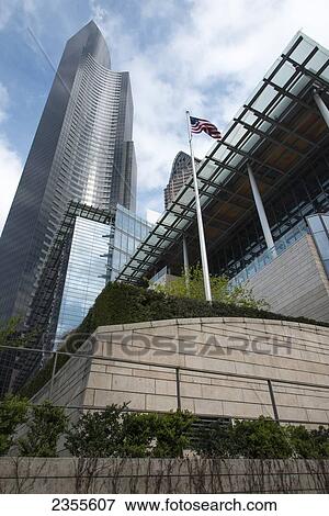 Stock Photo - Skyscrapers And The American Flag; Seattle, Washington, United States Of America. Fotosearch