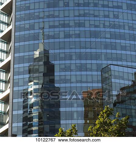 Skyscrapers reflected in the glass facade of another building; Santiago, Santiago Metropolitan Region, Chile View Large Photo Image Stock Photo - Skyscrapers reflected in the glass facade of another building; Santiago, Santiago Metropolitan Region, Chile. Fotosearch