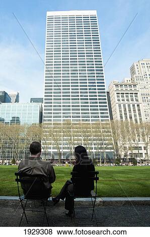 Skyscrapers Surrounding Bryant Park And People Enjoying The Sun; Garment District, Manhattan, New York, Usa View Large Photo Image Stock Photo - Skyscrapers Surrounding Bryant Park And People Enjoying The Sun; Garment District, Manhattan, New York, Usa. Fotosearch
