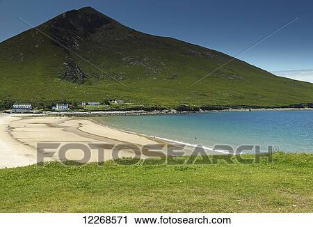 Stock Image - Slievemore mountain and Doogort beach on Achill island on the Wild Atlantic Way coastal route; County Mayo, Ireland. Fotosearch